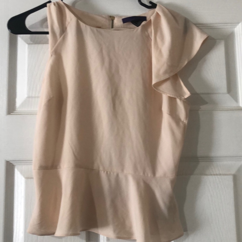 Beige blouse . Gold zipper on back